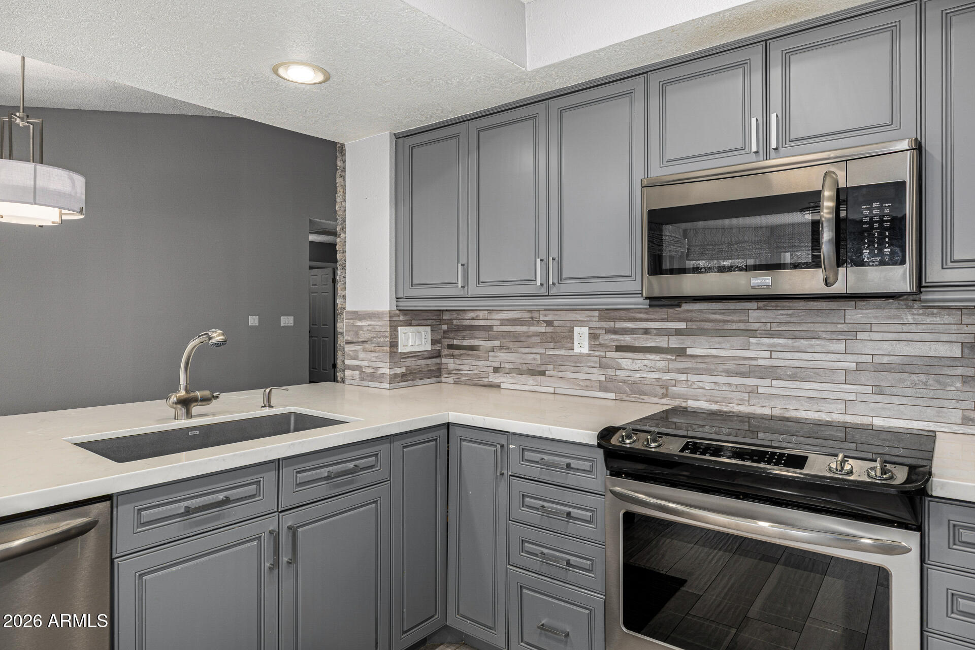 801 East Acoma Drive Phoenix, AZ 85022 - Photo 26 of 62 a kitchen with cabinets stainless steel appliances and sink