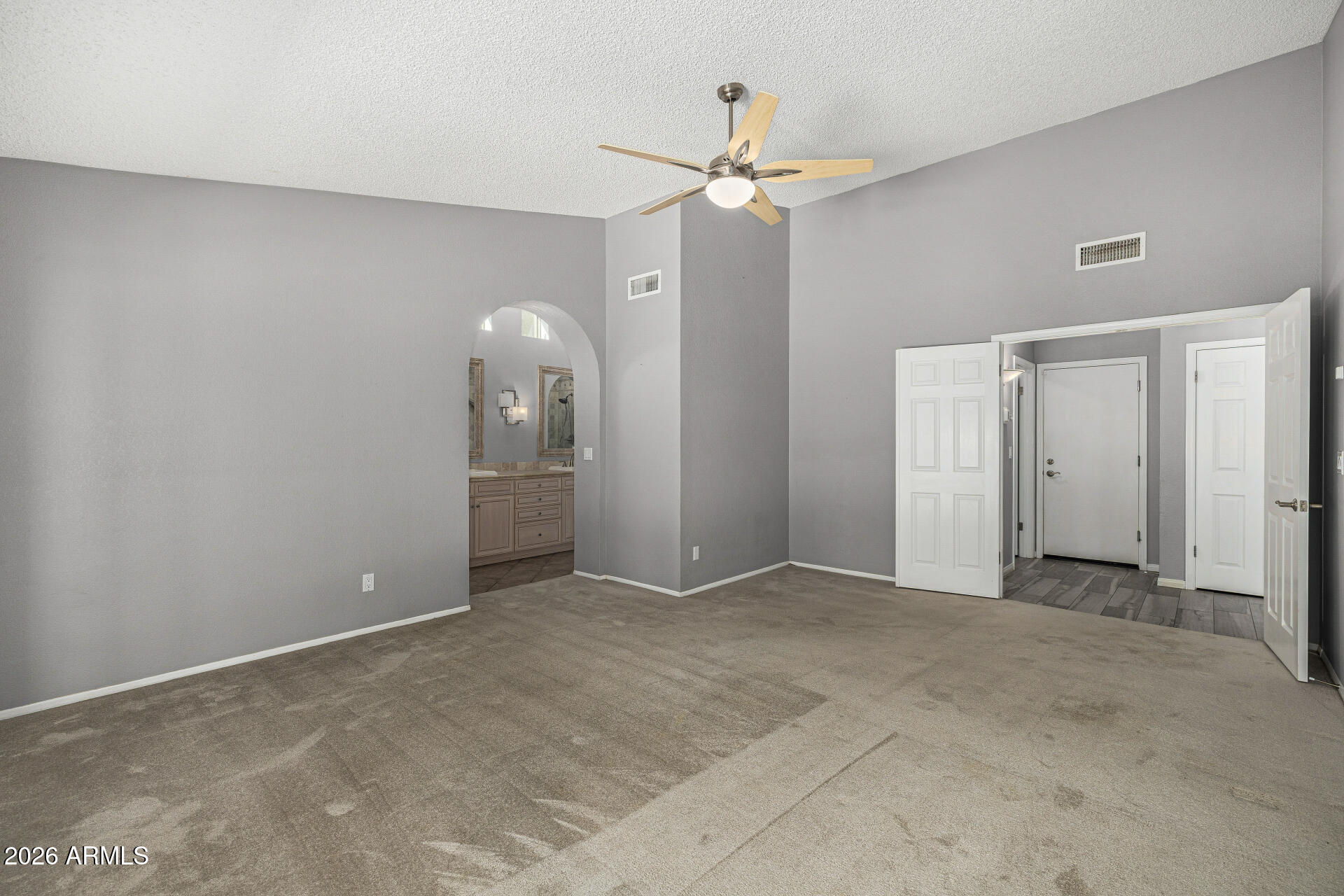 801 East Acoma Drive Phoenix, AZ 85022 - Photo 31 of 62 an empty room with fan and entrance