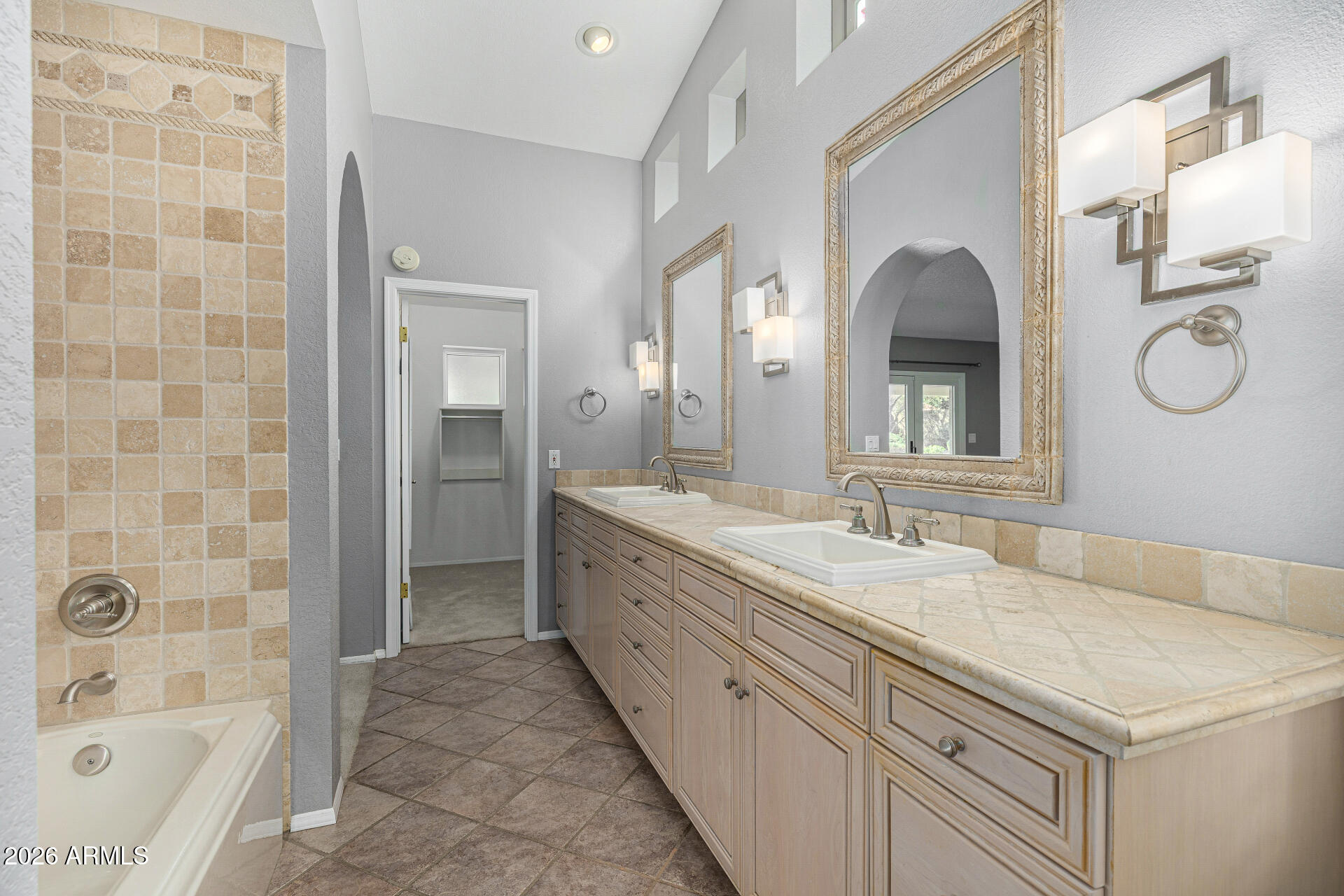 801 East Acoma Drive Phoenix, AZ 85022 - Photo 37 of 62 a spacious bathroom with a granite countertop sink a mirror and a bathtub