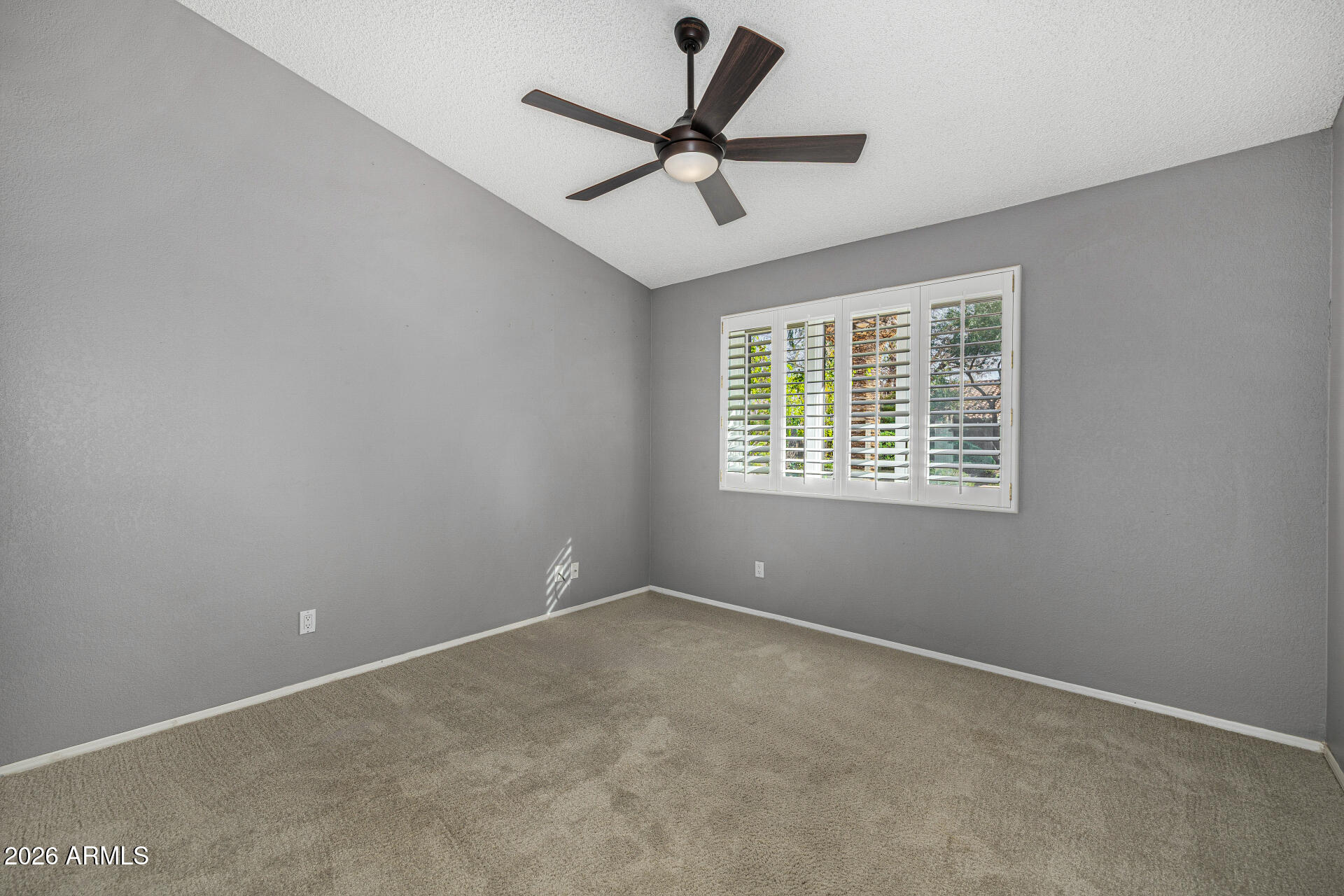 801 East Acoma Drive Phoenix, AZ 85022 - Photo 40 of 62 an empty room with a window and a fan