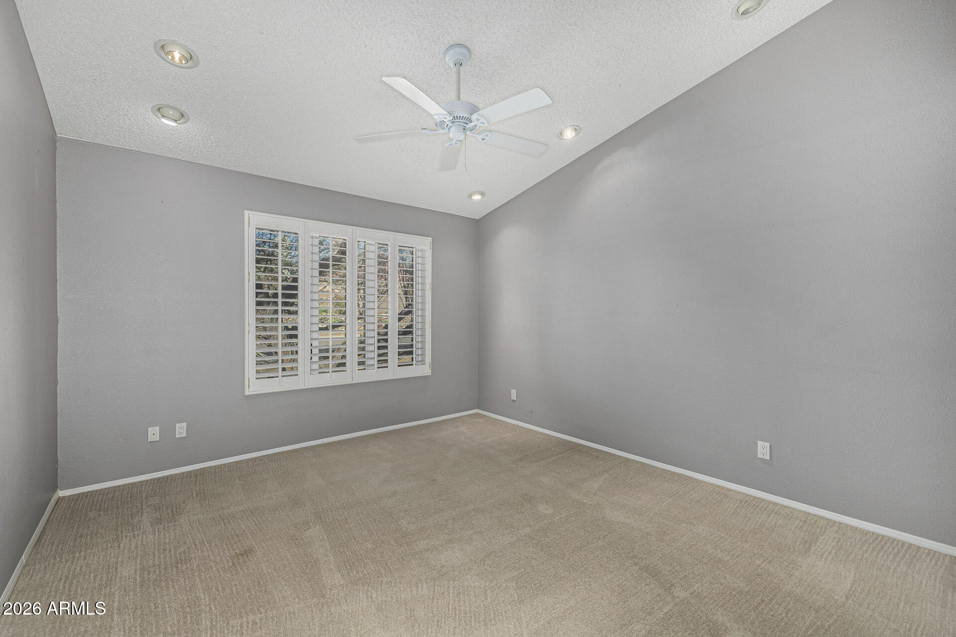 801 East Acoma Drive Phoenix, AZ 85022 - Photo 42 of 62 an empty room with a ceiling fan and window