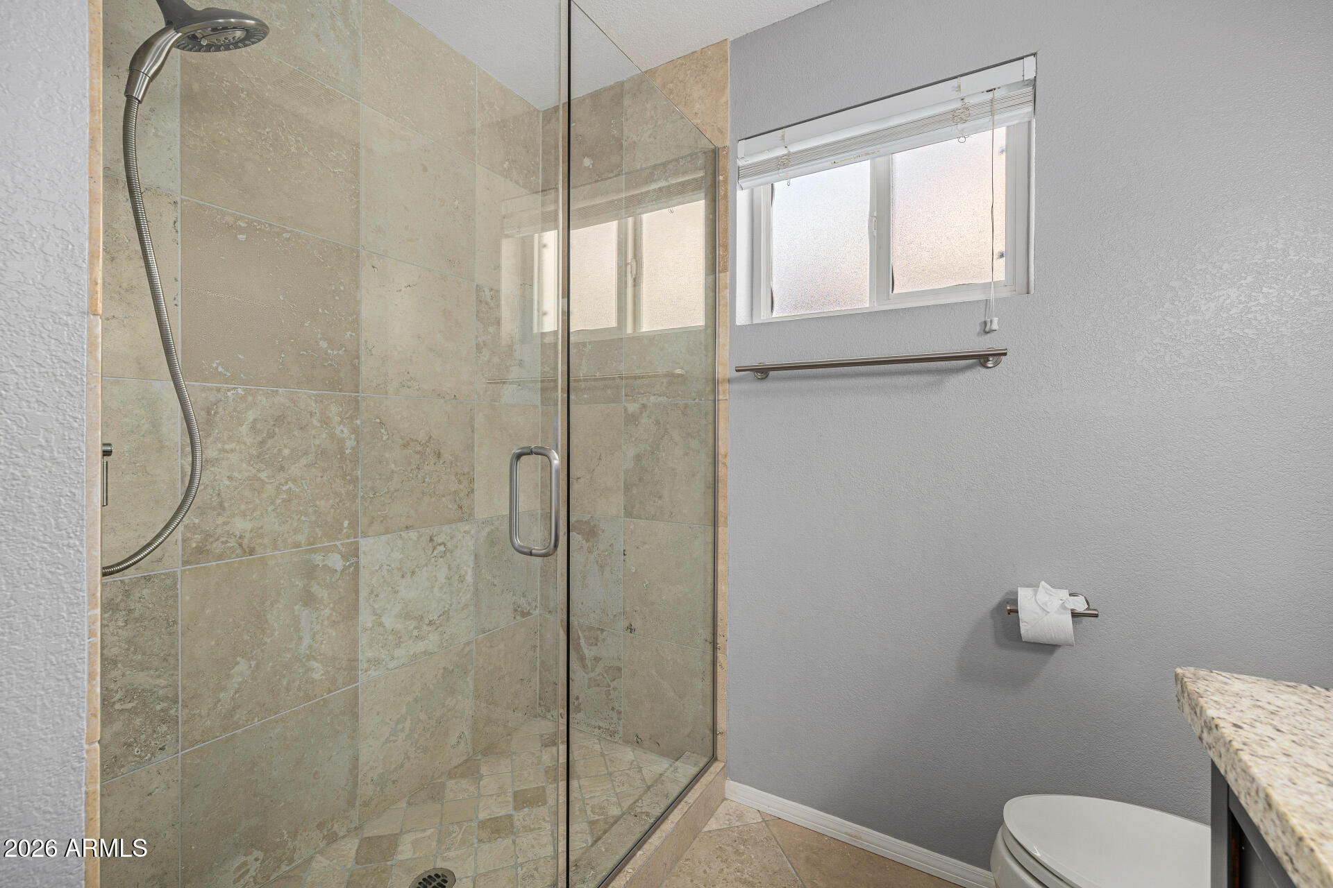 801 East Acoma Drive Phoenix, AZ 85022 - Photo 45 of 62 a bathroom with a granite countertop shower and a toilet