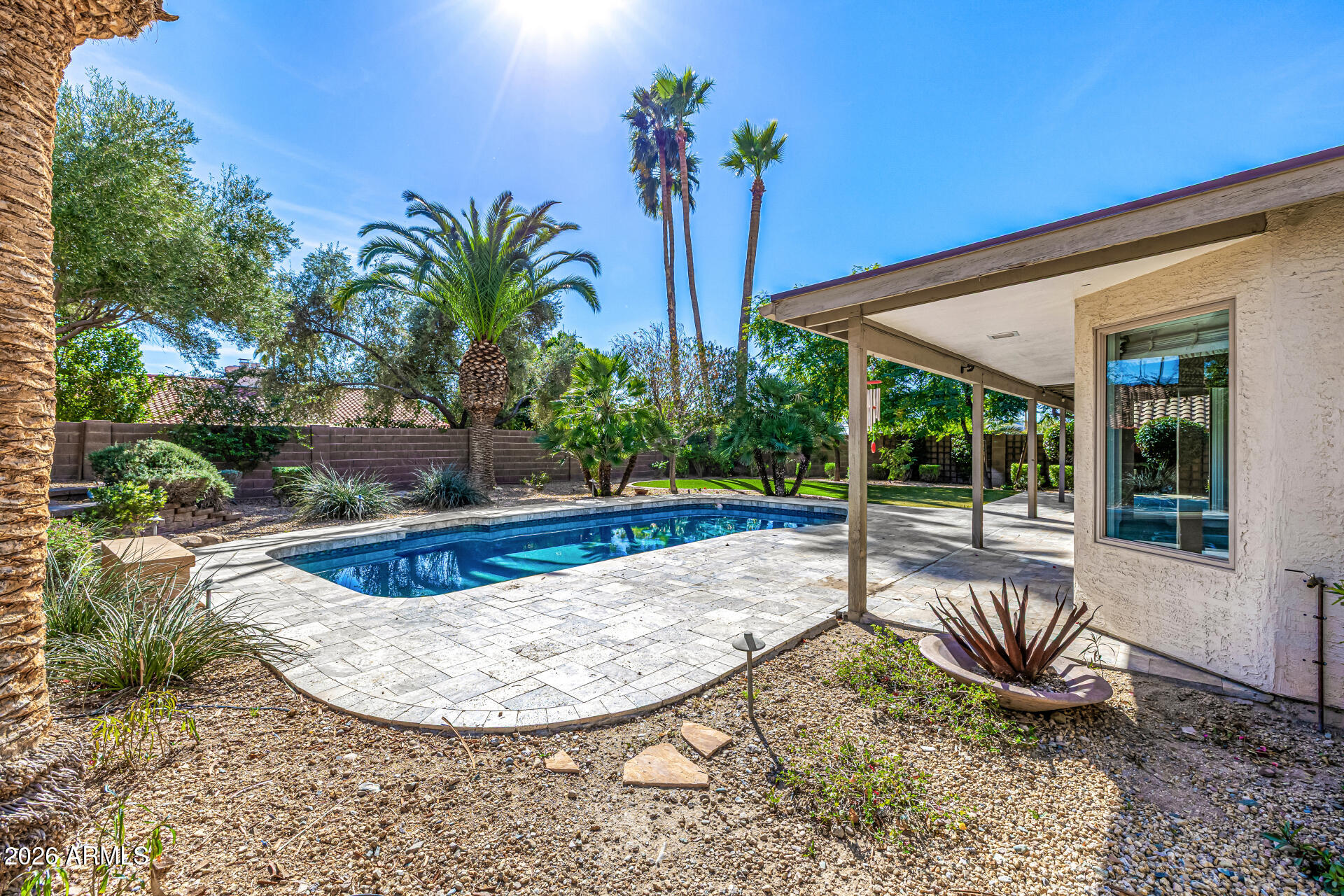 801 East Acoma Drive Phoenix, AZ 85022 - Photo 54 of 62 a view of a swimming pool with a lounge chair