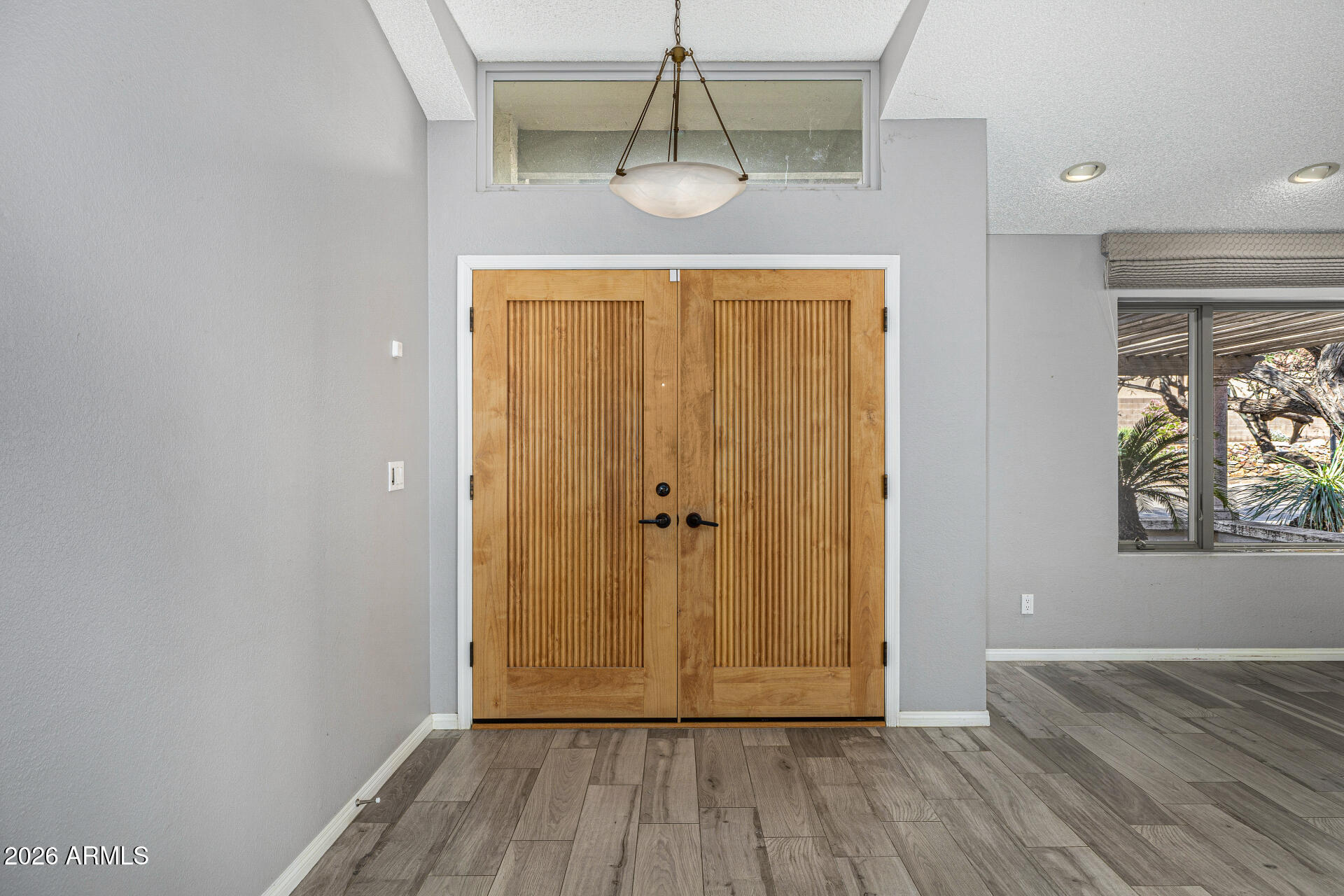 801 East Acoma Drive Phoenix, AZ 85022 - Photo 7 of 62 a view of a hallway with wooden floor and closet
