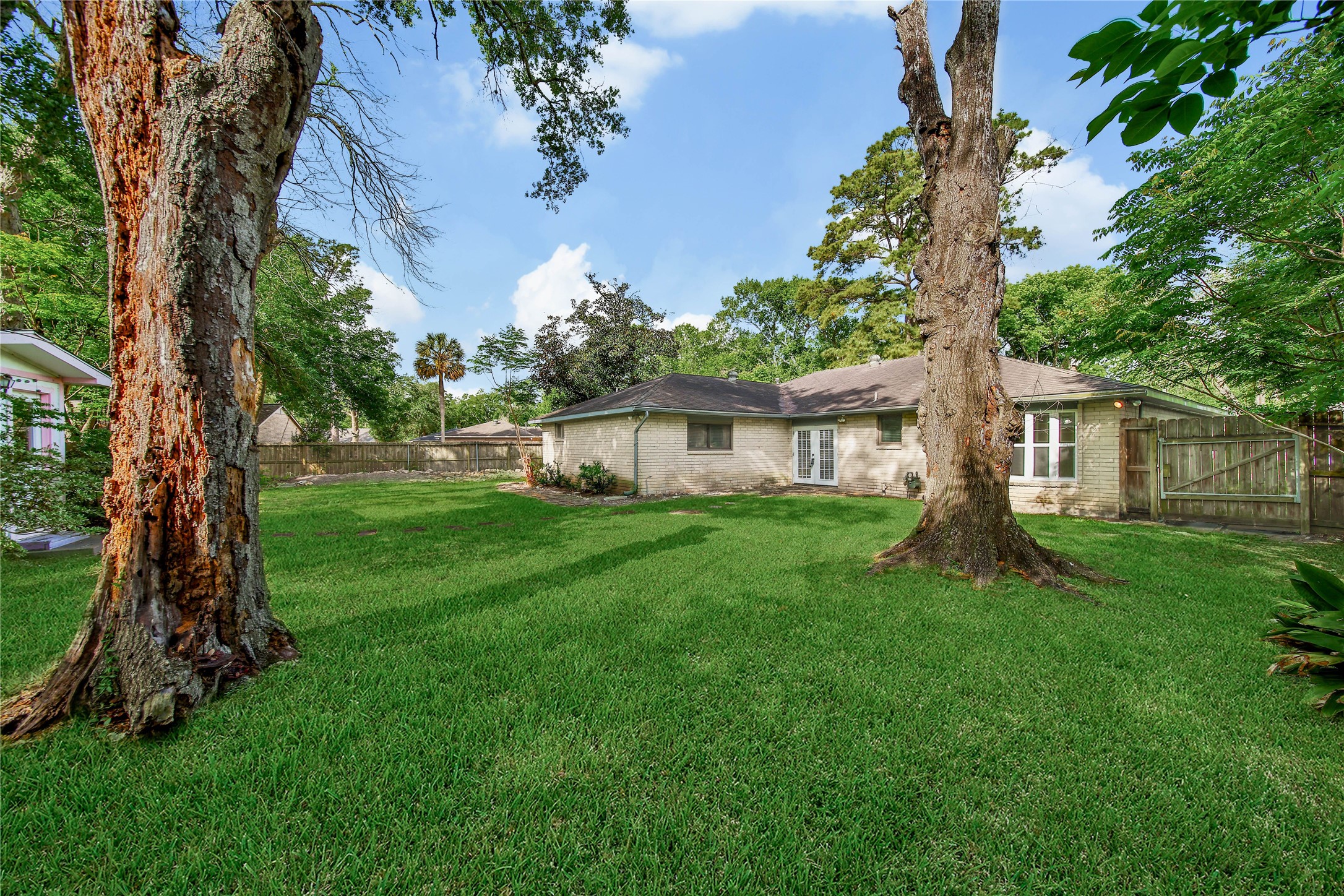 2006 Mermaid Lane Houston, TX 77062 - Photo 30 of 35 a view of a house with a yard and a tree