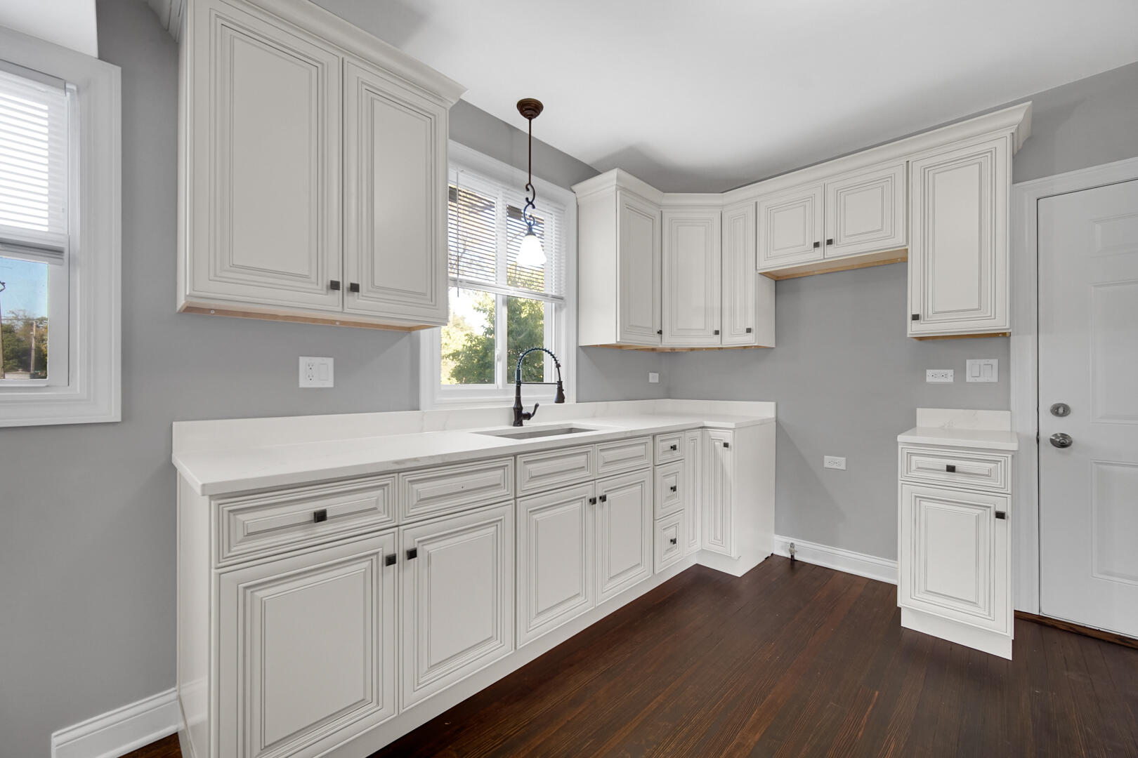327 Buchanan Street Gary, IN 46402 - Photo 14 of 29 a kitchen with white cabinets and a window