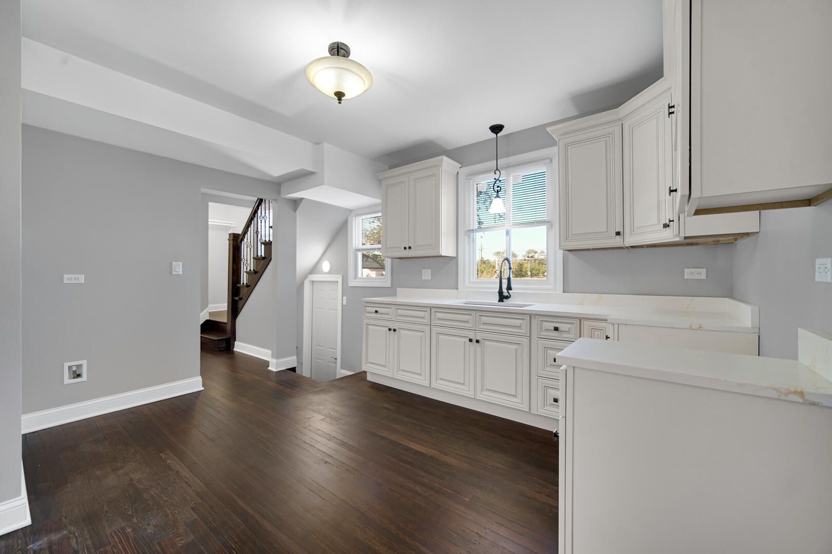 327 Buchanan Street Gary, IN 46402 - Photo 16 of 29 a kitchen with cabinets and wooden floor