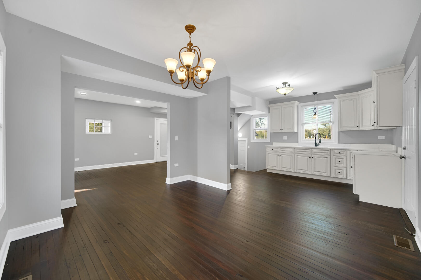 327 Buchanan Street Gary, IN 46402 - Photo 17 of 29 a view of a kitchen with a sink and wooden floor