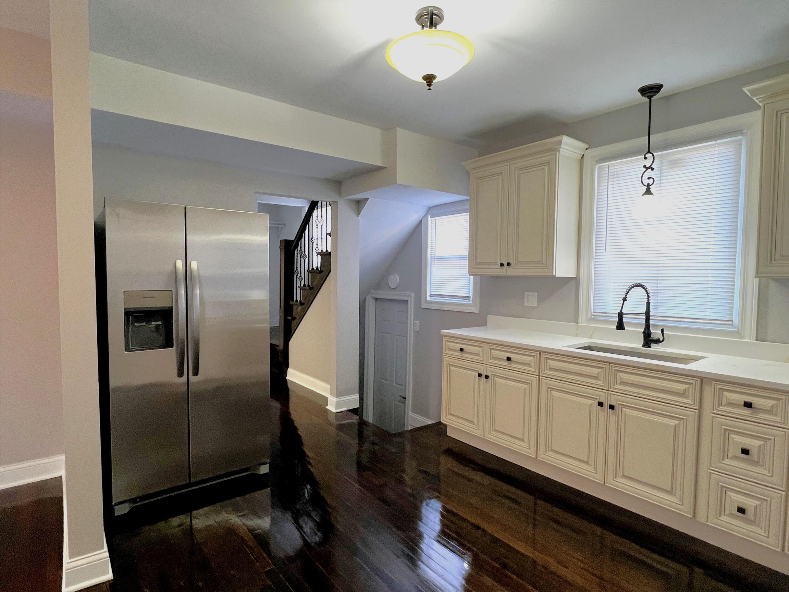 327 Buchanan Street Gary, IN 46402 - Photo 18 of 30 a kitchen with sink refrigerator and cabinets