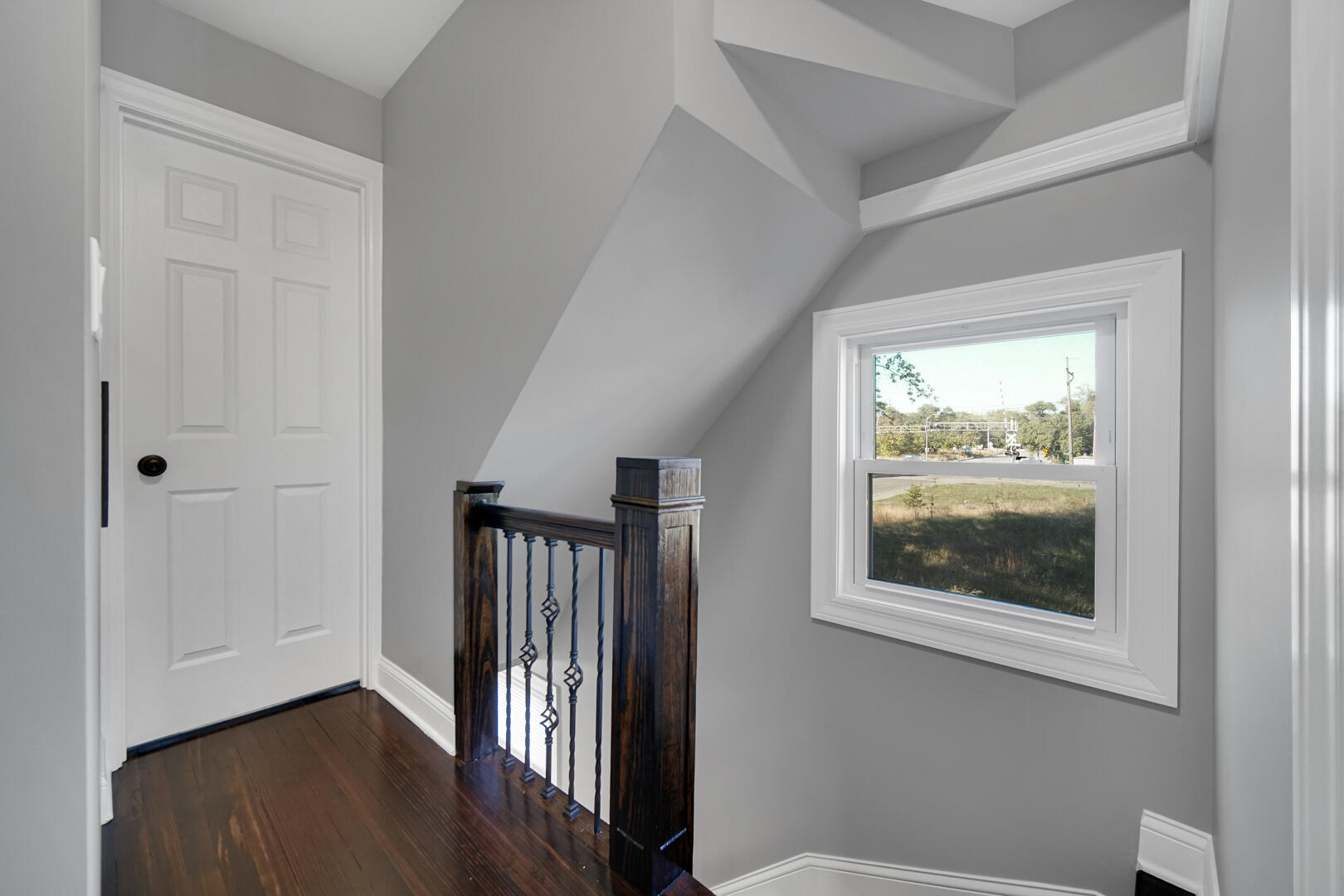 327 Buchanan Street Gary, IN 46402 - Photo 19 of 29 a view of a hallway with wooden floor and a window