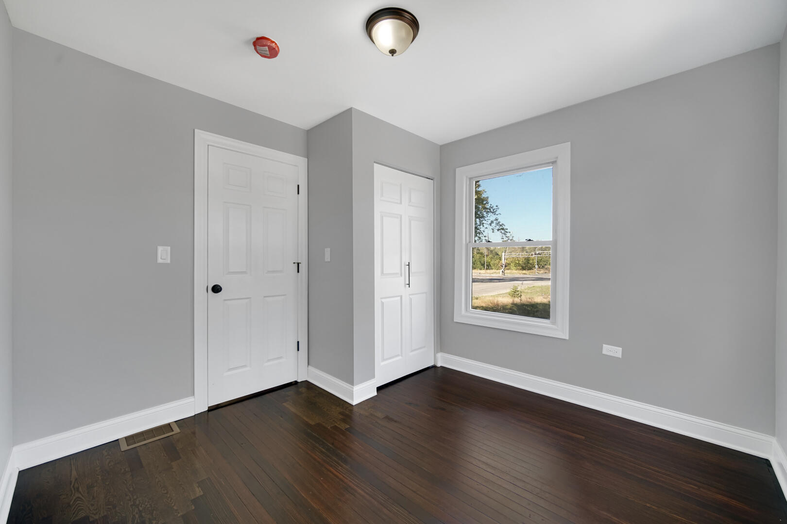 327 Buchanan Street Gary, IN 46402 - Photo 25 of 29 an empty room with wooden floor and windows