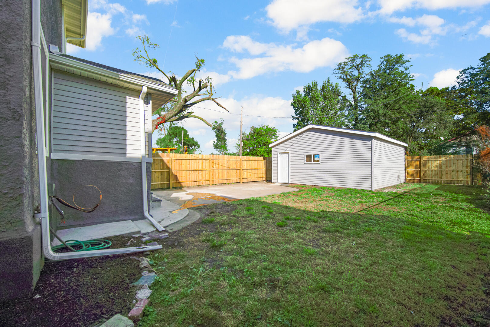 327 Buchanan Street Gary, IN 46402 - Photo 4 of 29 a backyard of a house with lots of green space