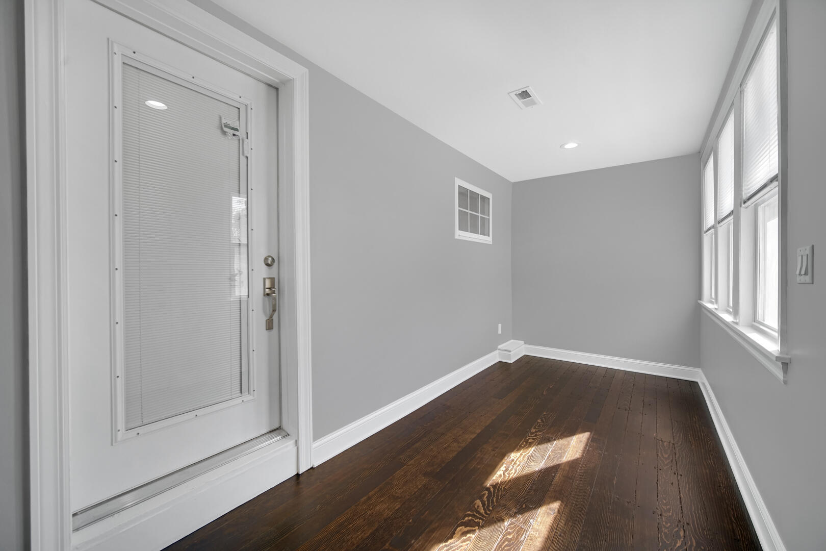 327 Buchanan Street Gary, IN 46402 - Photo 8 of 29 a view of empty room with wooden floor and fan