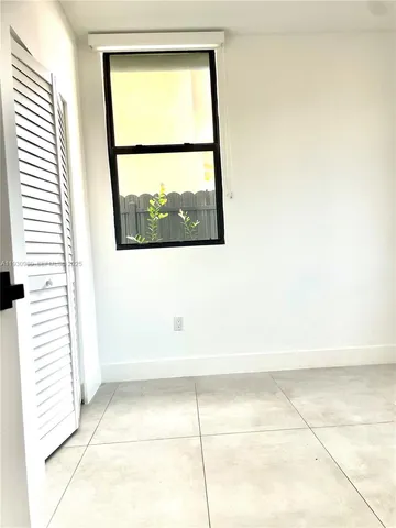 an empty room with a mirror