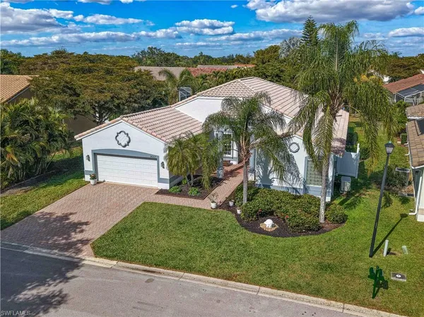 a view of a garden with a building in the background