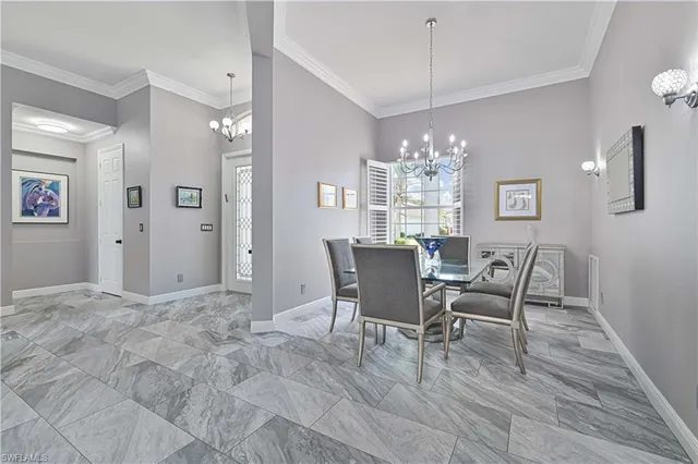 a kitchen with stainless steel appliances kitchen island granite countertop a refrigerator and microwave