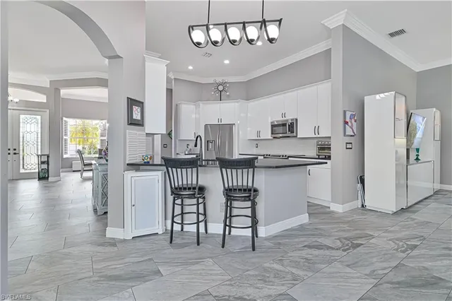 a kitchen with counter space cabinets and appliances