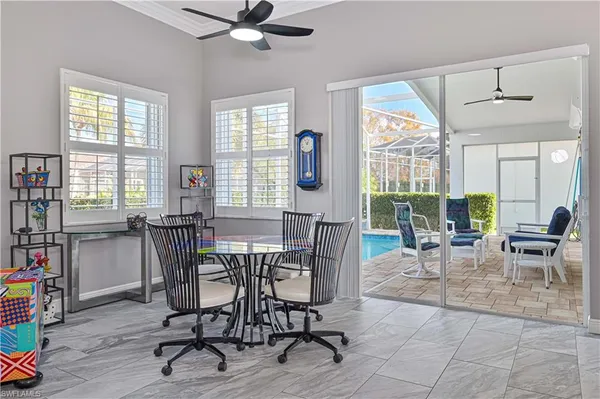 a view of a dining room with furniture window and wooden floor