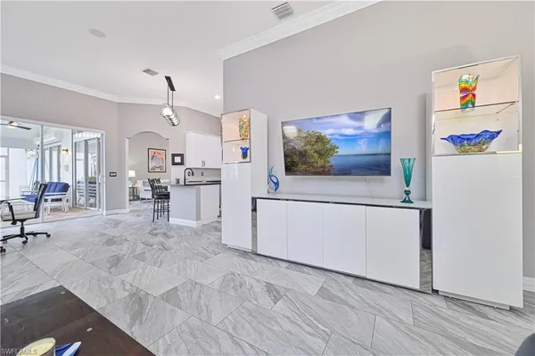 a view of kitchen with furniture and refrigerator