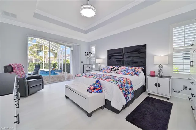 a bedroom with bed and a couch