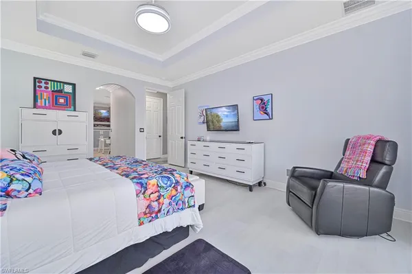 a bedroom with bed and a couch