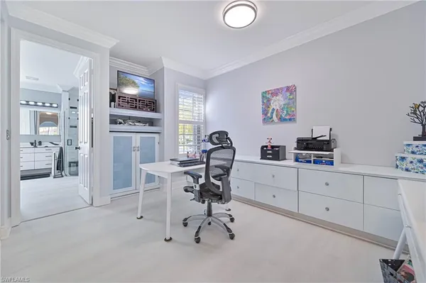 a work room with furniture and a window