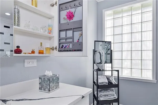 a cabinet with wine cabinets and window