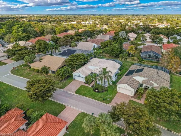 an aerial view of residential houses with outdoor space and river