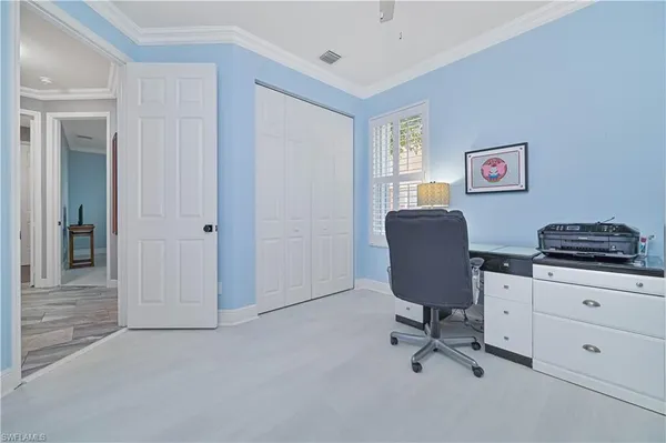 a workspace with furniture and a window