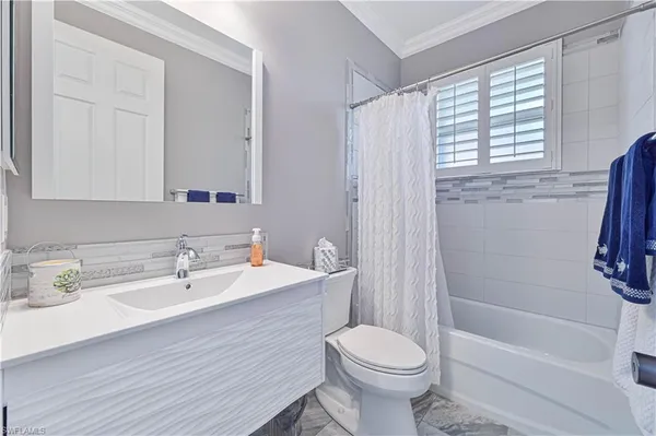 a bathroom with a sink a toilet and a bathtub