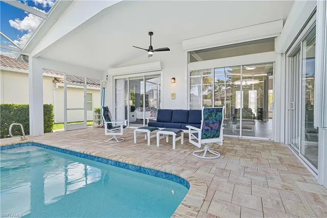 an aerial view of residential houses with yard