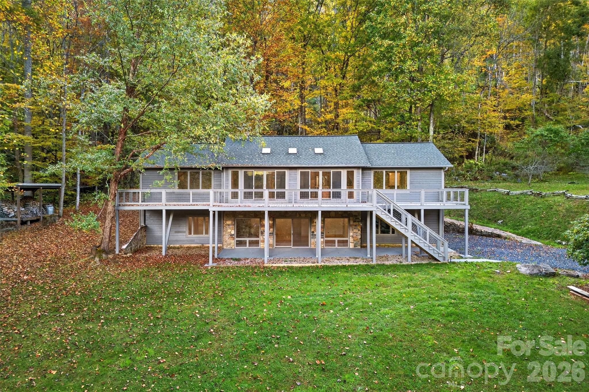 575 Croft Way Bakersville, NC 28705 - Photo 2 of 38 a view of a house with pool and a yard