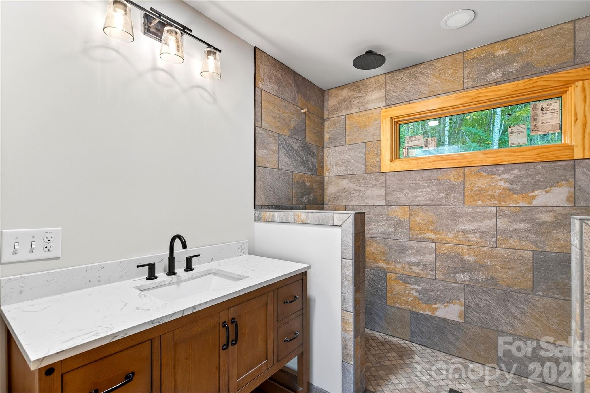 575 Croft Way Bakersville, NC 28705 - Photo 22 of 38 a view of a bathroom with a sink and mirror