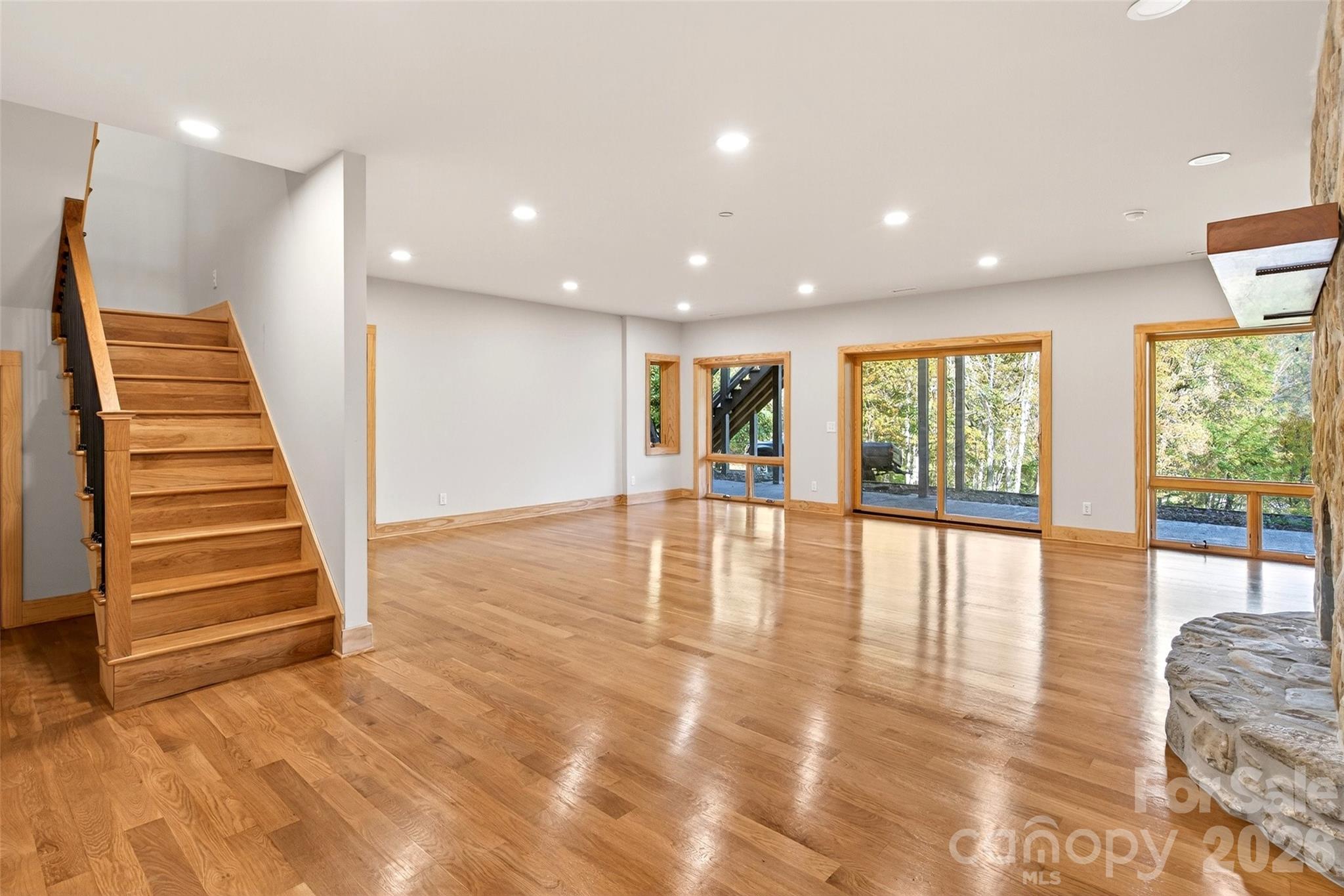 575 Croft Way Bakersville, NC 28705 - Photo 24 of 38 a view of an empty room with wooden floor and a window