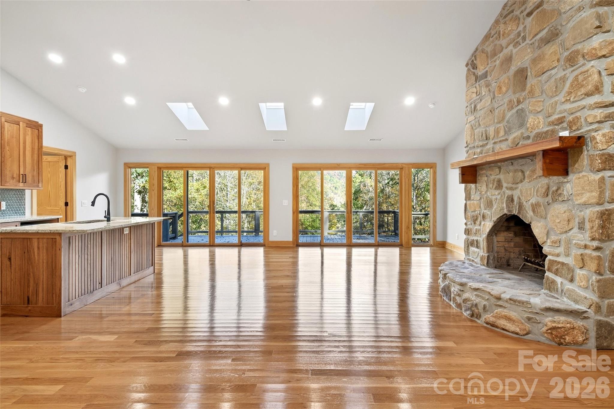 575 Croft Way Bakersville, NC 28705 - Photo 5 of 38 a view of a living room with hardwood floor and a large window