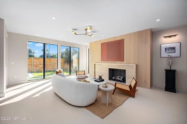a kitchen with stainless steel appliances granite countertop a stove a sink and a white cabinets