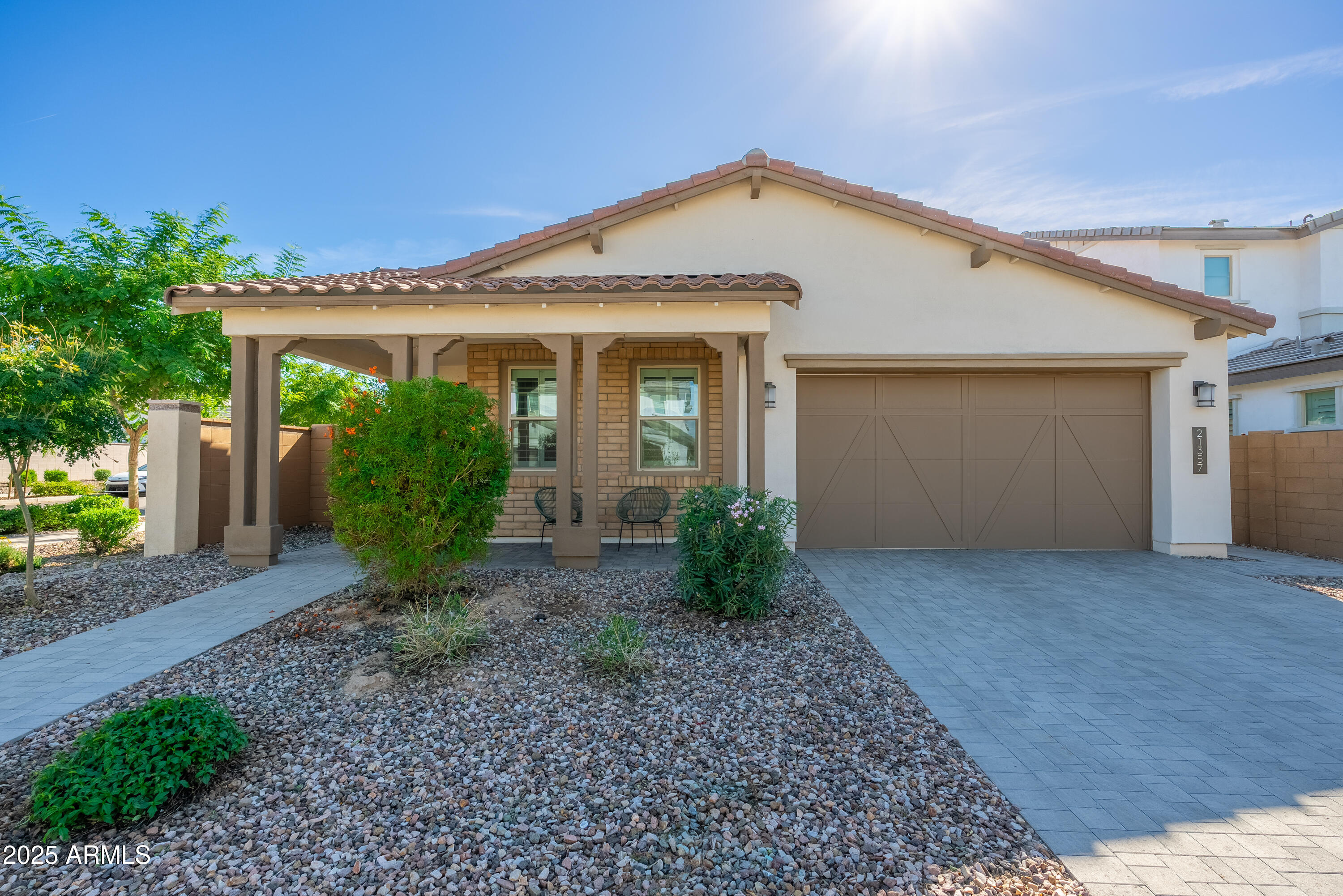 21357 East Macaw Drive Queen Creek, AZ 85142 - Photo 1 of 48 a front view of a house with garden
