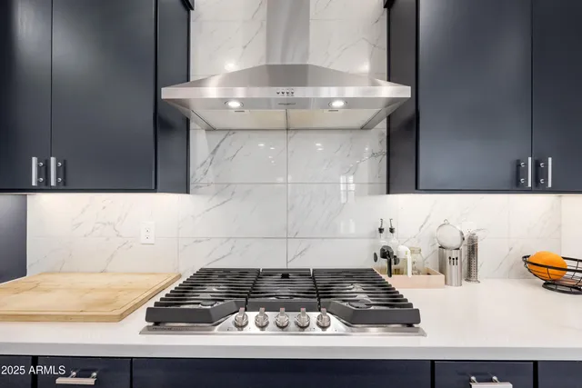 a kitchen with a stove and a cabinets