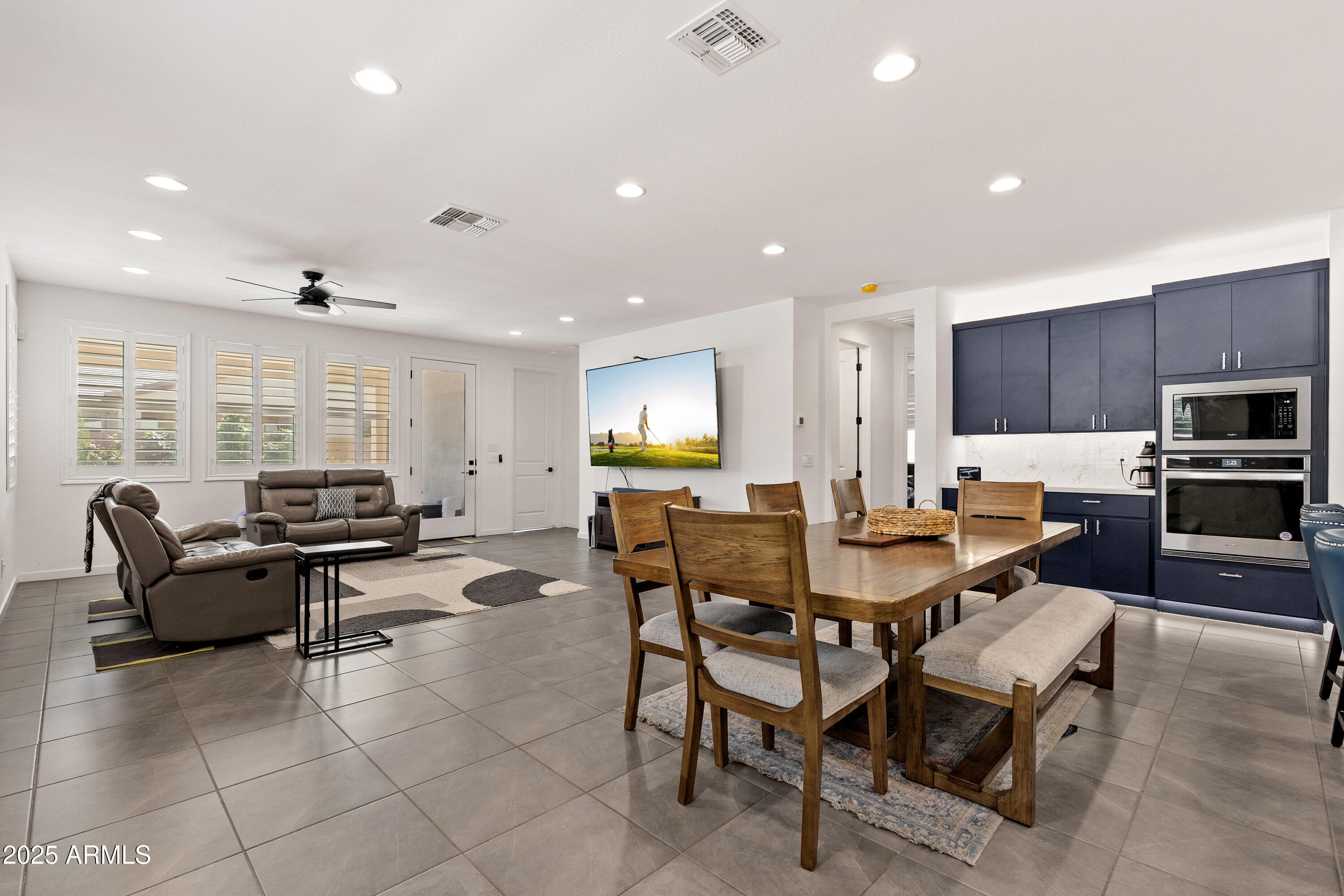 21357 East Macaw Drive Queen Creek, AZ 85142 - Photo 13 of 48 a living room with fireplace furniture and a large window