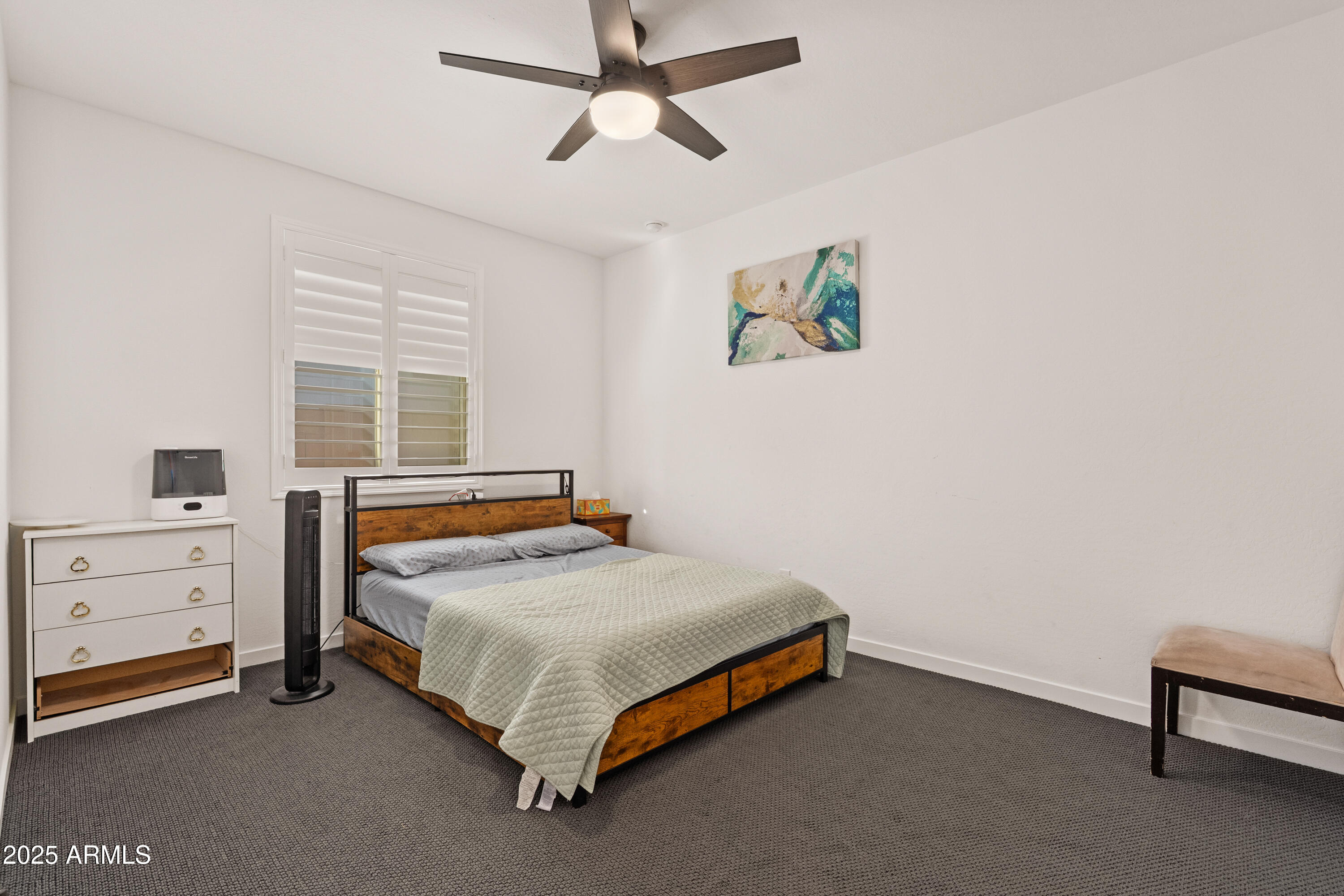 21357 East Macaw Drive Queen Creek, AZ 85142 - Photo 20 of 48 a bedroom with a bed and a window