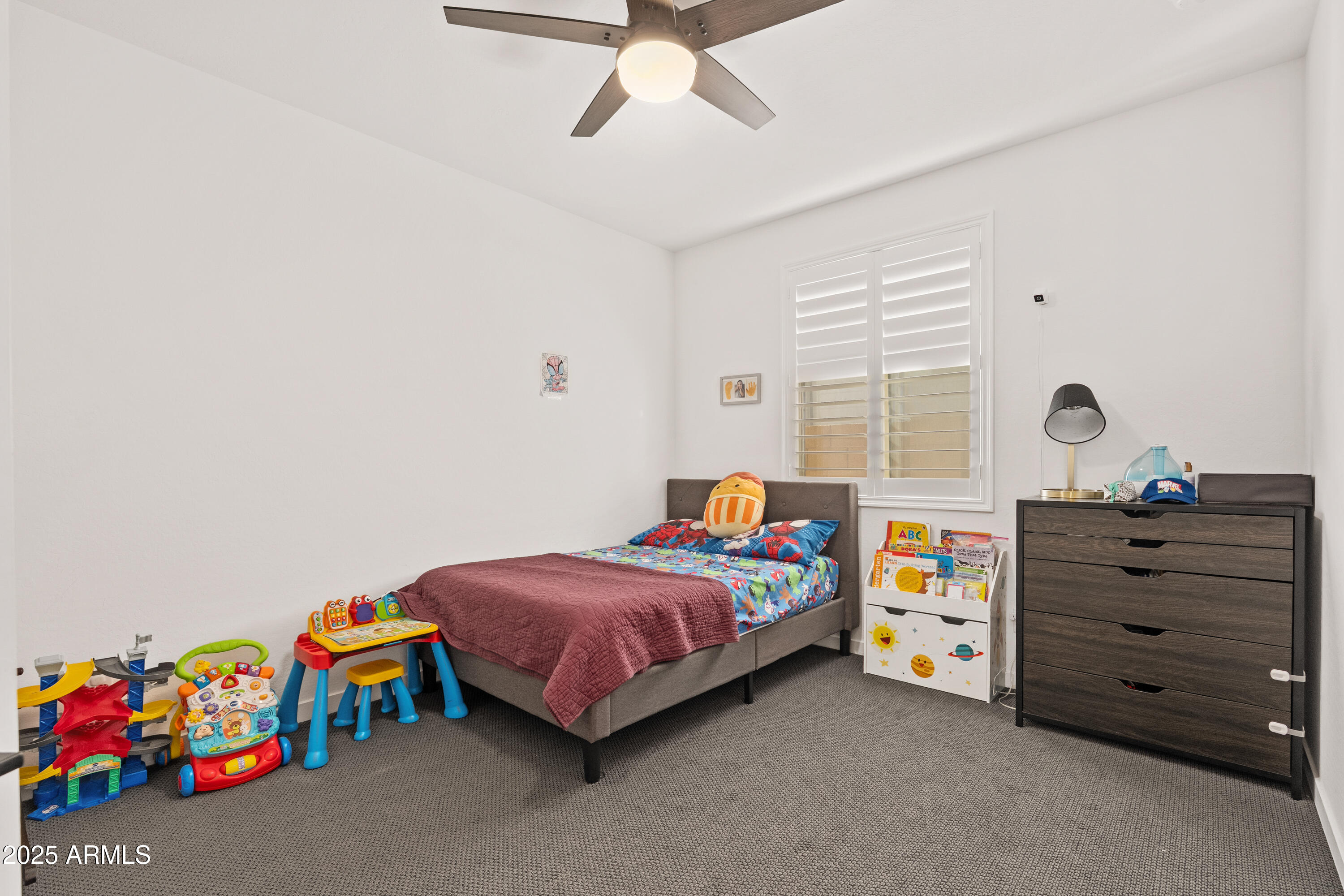 21357 East Macaw Drive Queen Creek, AZ 85142 - Photo 21 of 48 a bedroom with a bed and a dresser in it