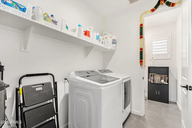 a utility room with dryer and washer