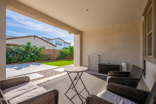 a living room with furniture and a garden