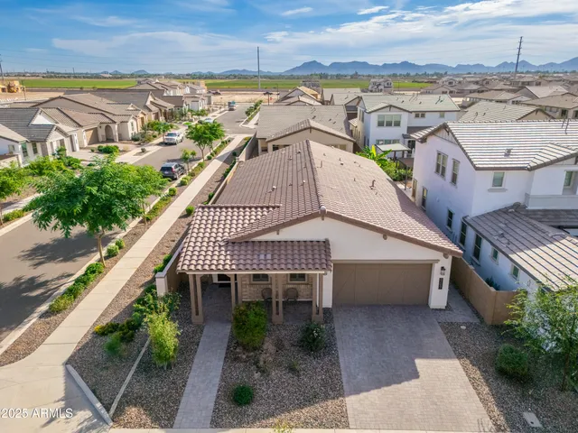 an aerial view of a house with a garden