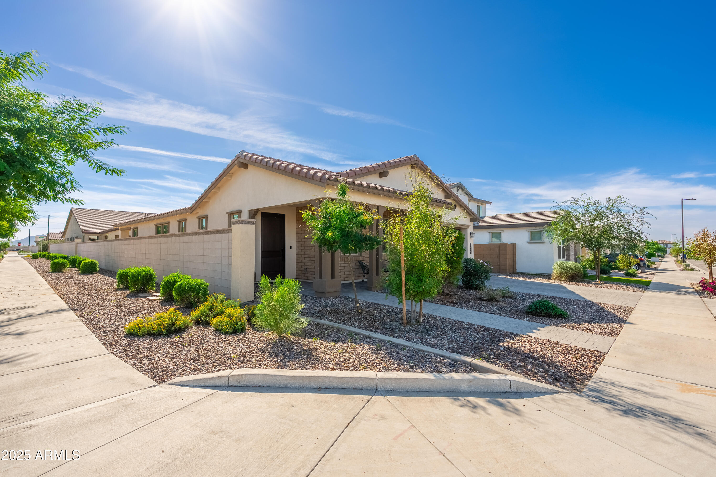 21357 East Macaw Drive Queen Creek, AZ 85142 - Photo 3 of 48 a front view of a house with garden