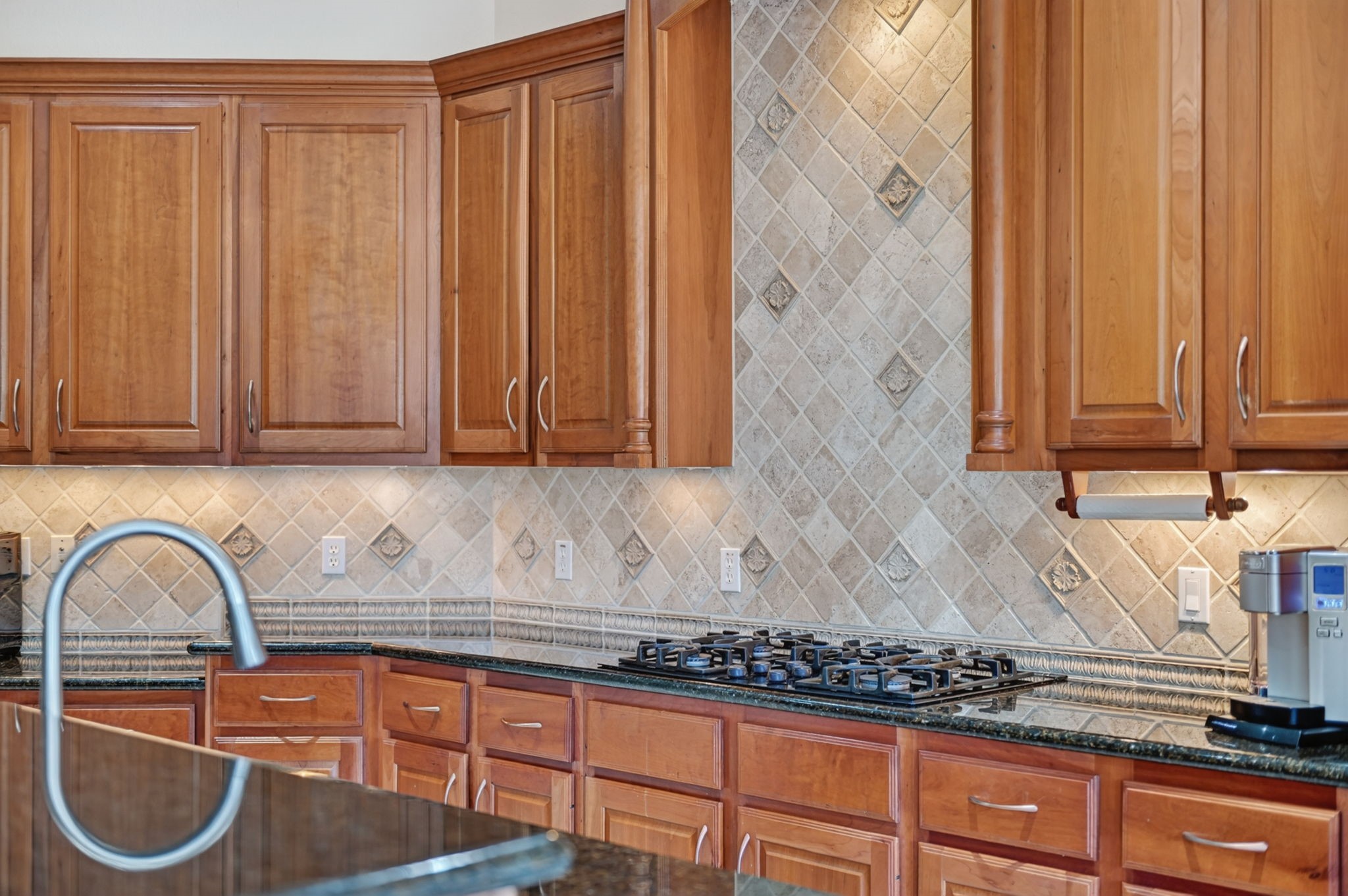 15 White Meadow Court Spring, TX 77379 - Photo 11 of 48 Under cabinet lighting,tumbled marble backsplash and gas cooktop