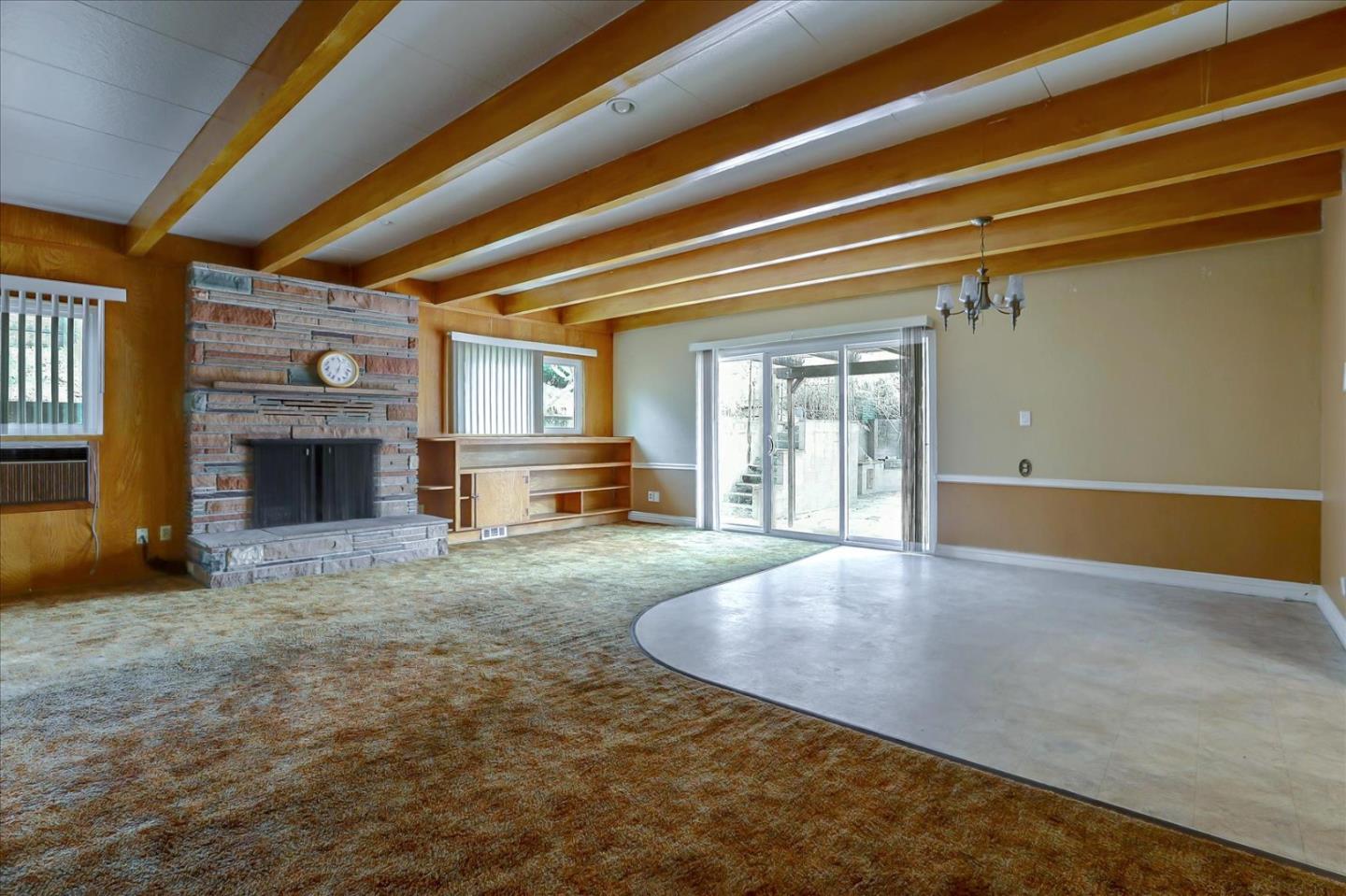 10150 Clayton Road San Jose, CA 95127 - Photo 12 of 61 a view of a livingroom with wooden floor and a fireplace