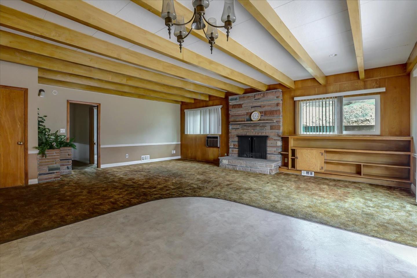 10150 Clayton Road San Jose, CA 95127 - Photo 13 of 61 a living room with fireplace furniture and a window
