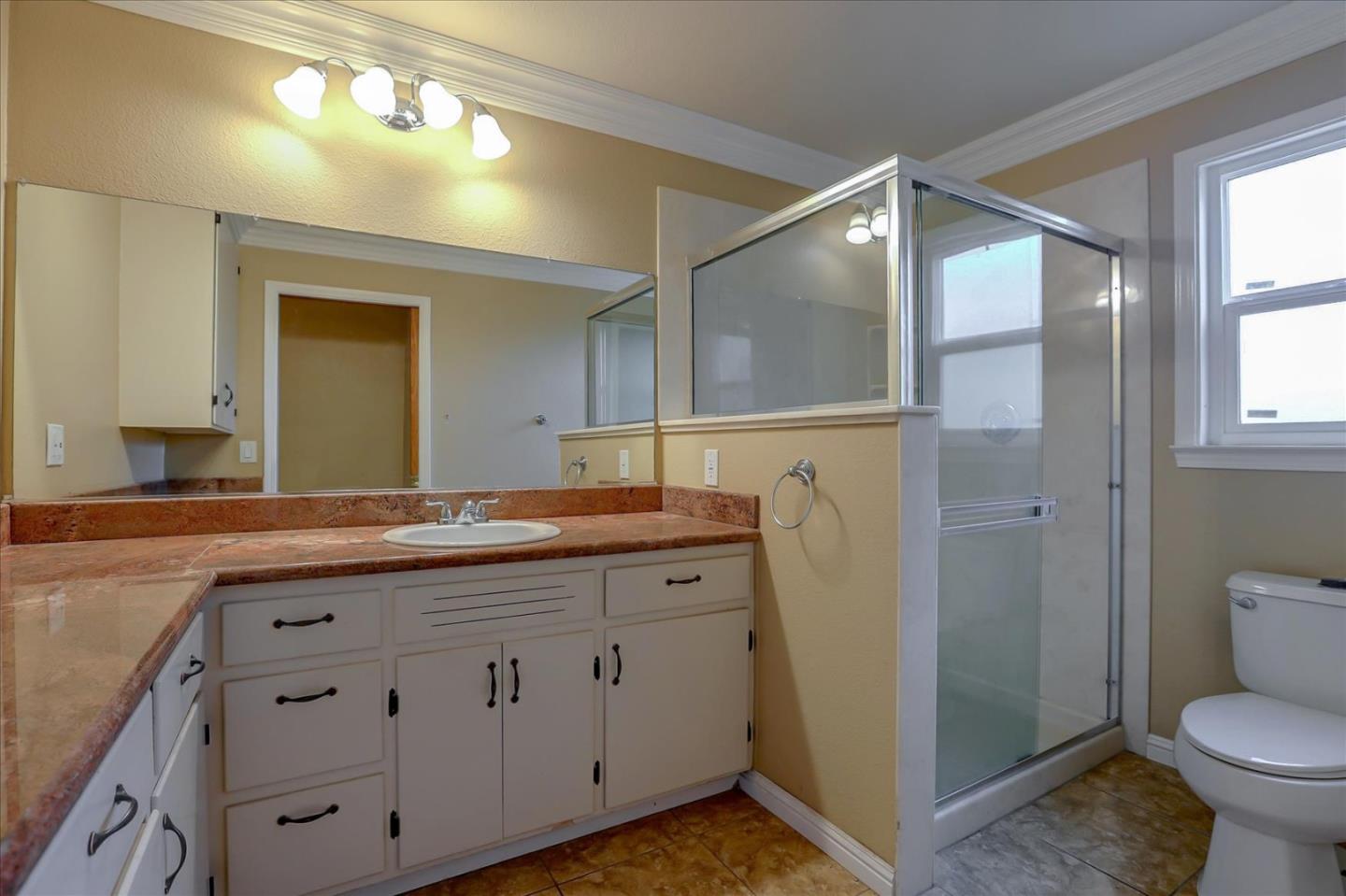 10150 Clayton Road San Jose, CA 95127 - Photo 17 of 61 a bathroom with a granite countertop sink mirror and toilet
