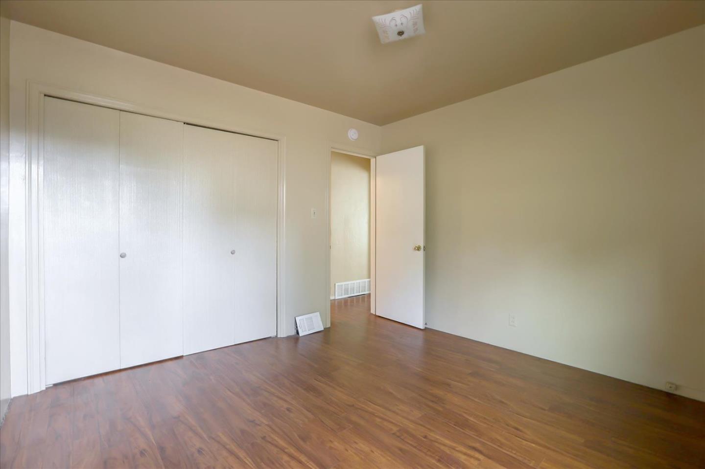10150 Clayton Road San Jose, CA 95127 - Photo 19 of 61 a view of an empty room with wooden floor